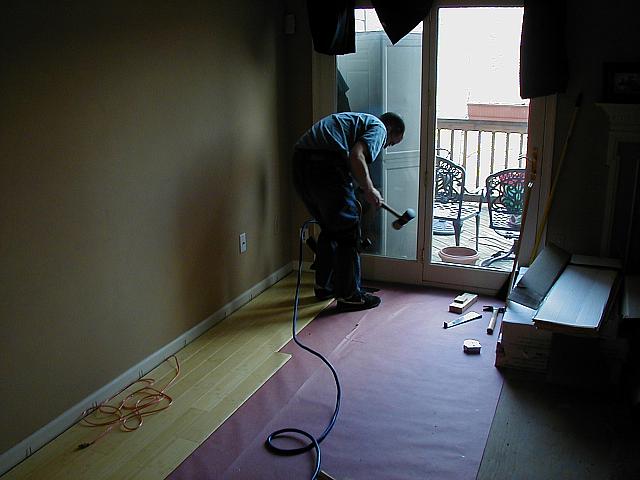 Hammering in planks.
