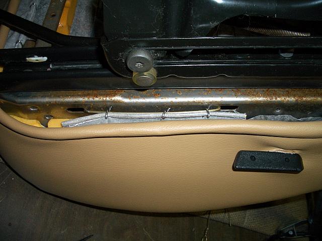 I strung a coathanger through the 2 holes and hog-ringed it to the hanger.