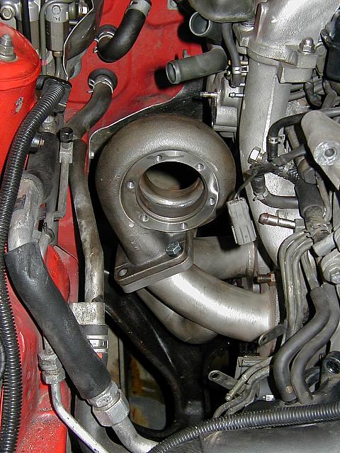 The HKS tubular stainless manifold that I got a good deal on $300.  Equal length & heavy duty.  Notice the water pipe to the