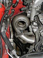 The HKS tubular stainless manifold that I got a good deal on $300.  Equal length & heavy duty.  Notice the water pipe to the
