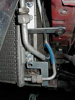 Here you can see both drivers side AC condensor mounts.  The bottom attaches to the radiator mount plates, supplied by Blitz.